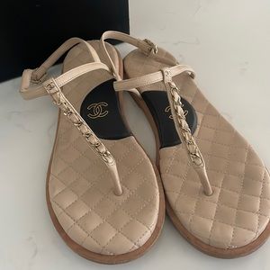 Chanel cream and black sandals.